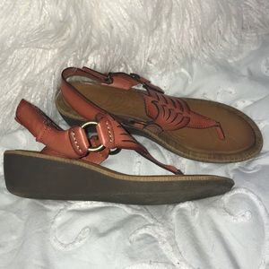 Clark’s coral colored sandals.